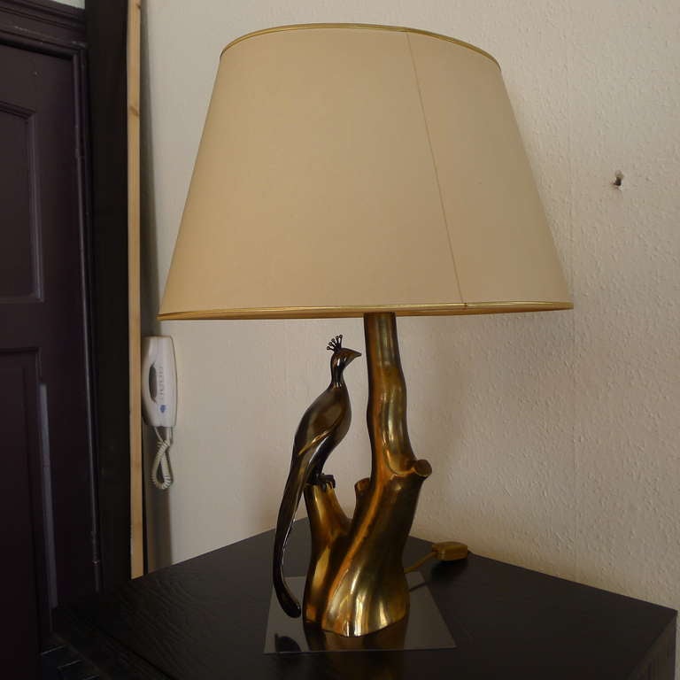 A peacock table lamp in bronze