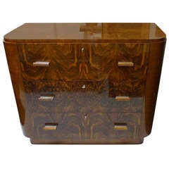 A Walnut Decoene Chest Of Drawers A Walnut Decoene Chest Of Drawers