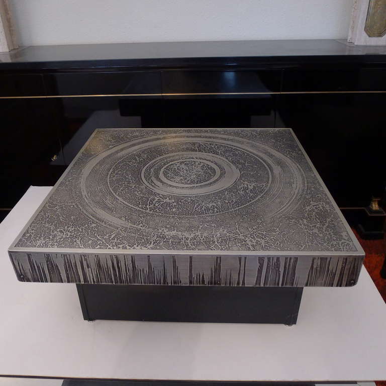 a nickeled bronze etched coffee table with blackened base.