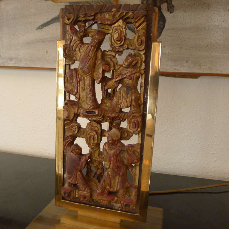 Belgian a tablelamp in bronze with a chinese decorative panel.