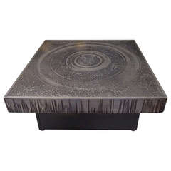 a signed Marc D'Haenens nickeled bronze etched coffee table.