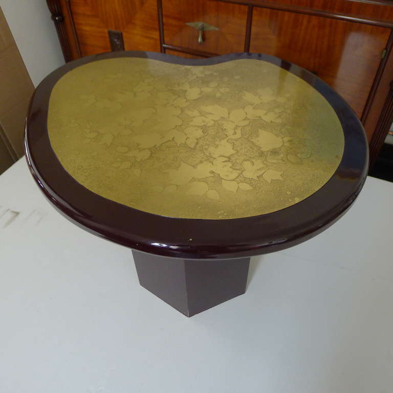 Etched bronze deep red lacquered free form coffee table.