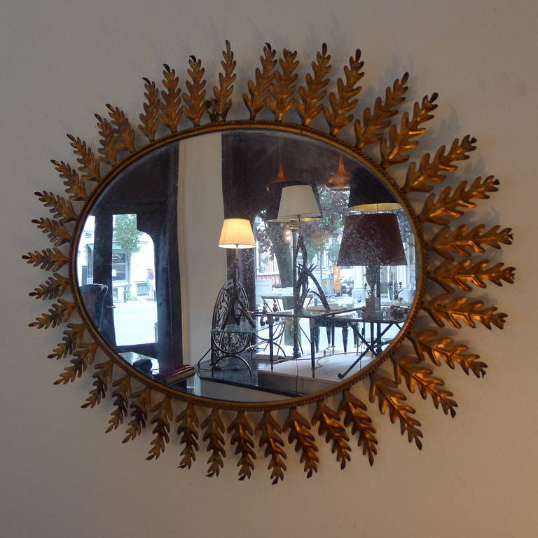 An oak gilded metal mirror.