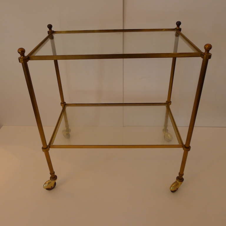 a two tier bar cart in bronze attributed to Jansen