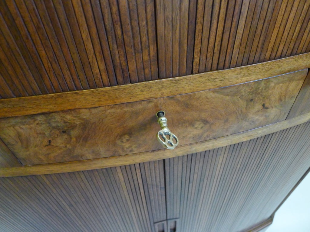 A walnut encoignure with tambour doors and CB HANSENS ETABL
KOBENHAVN label.