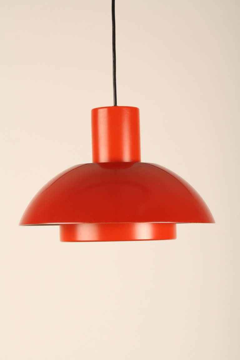 Red metal Danish lamp. The basic form is the quality of this design. Diameter 34cm.