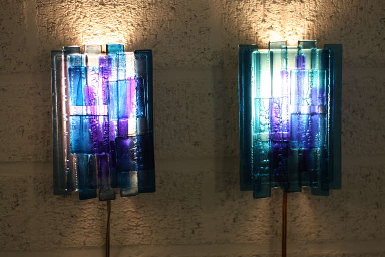 Claus Bolby. A set of two Claus Bolby lamps. The lamps are of acrylic and have bulbs behind the acrylic. Claus Bolby has experimented with the airbulbs, and this is the result. The acrylic looks like glass, and the bulbs are playing with the light.