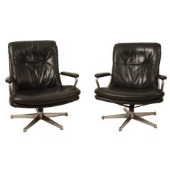 A set of Swiss Strässle chairs in black leather with nice patine