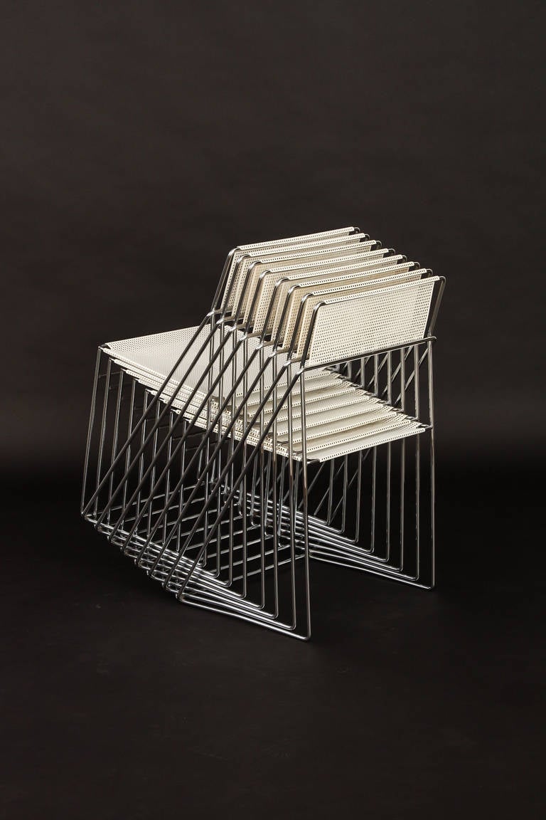 Two sets of six metal X-line chairs. The chairs have a  graphic form, minimalistic. Super stackable. The sitting and the back are of white metal performed like Pilastro and Mategot. The frame is of chrome-plated steel.

The price is for a set of