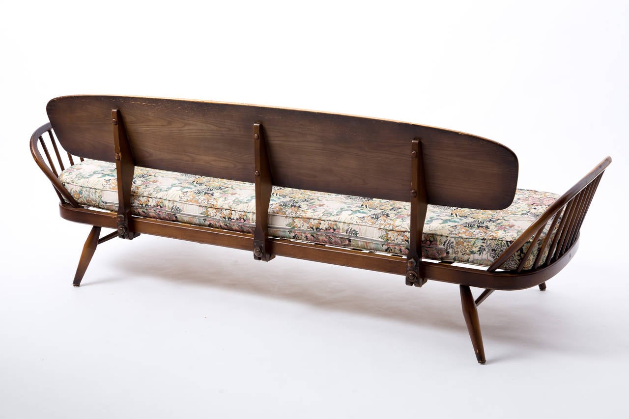 Mid-Century Modern Ercol sofa plus footstool with romantic embroidery