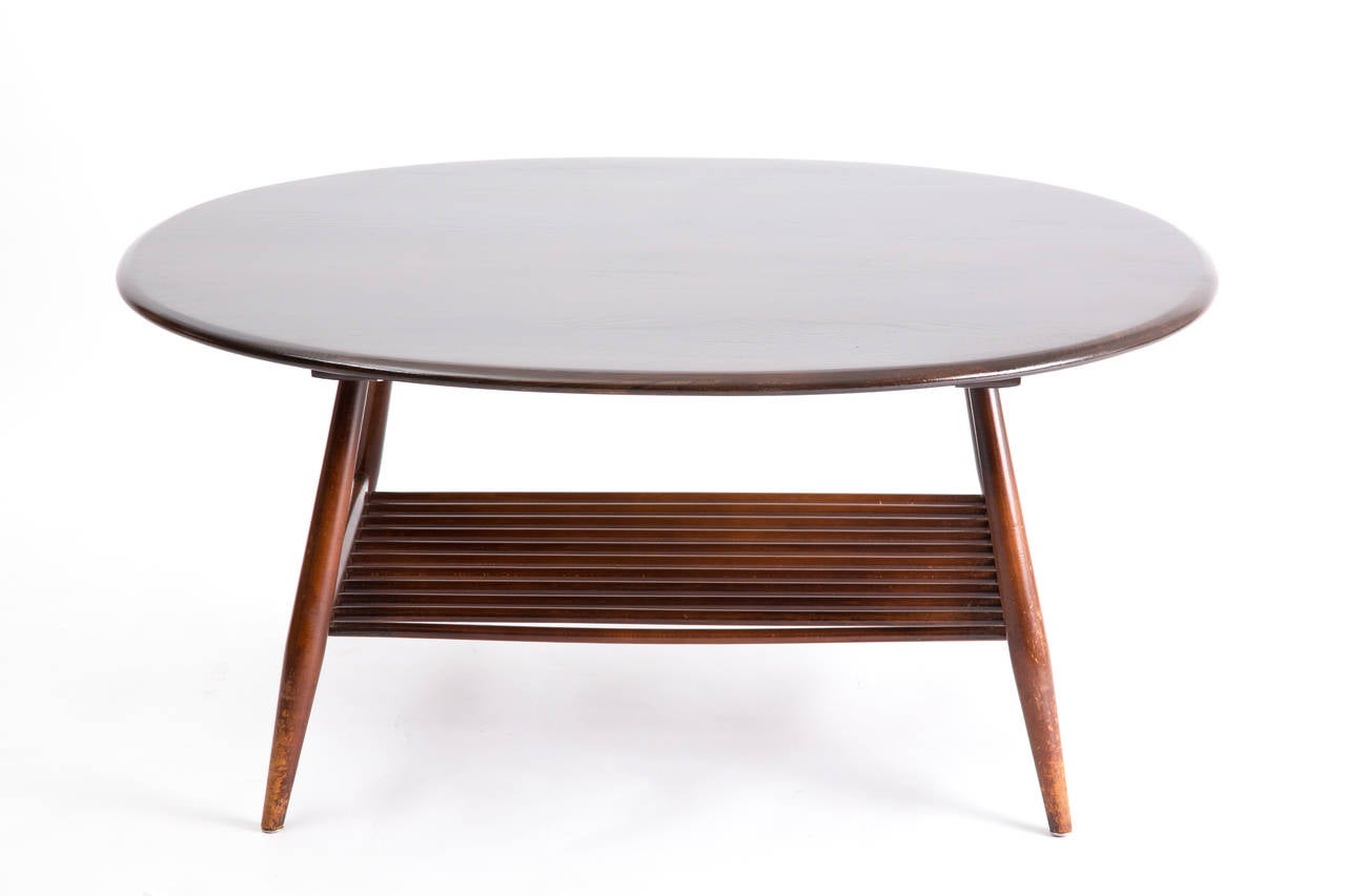 Ercol england oval table with magazin layer at 1stDibs