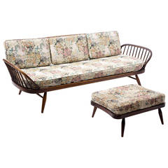 Vintage Ercol sofa plus footstool with romantic embroidery