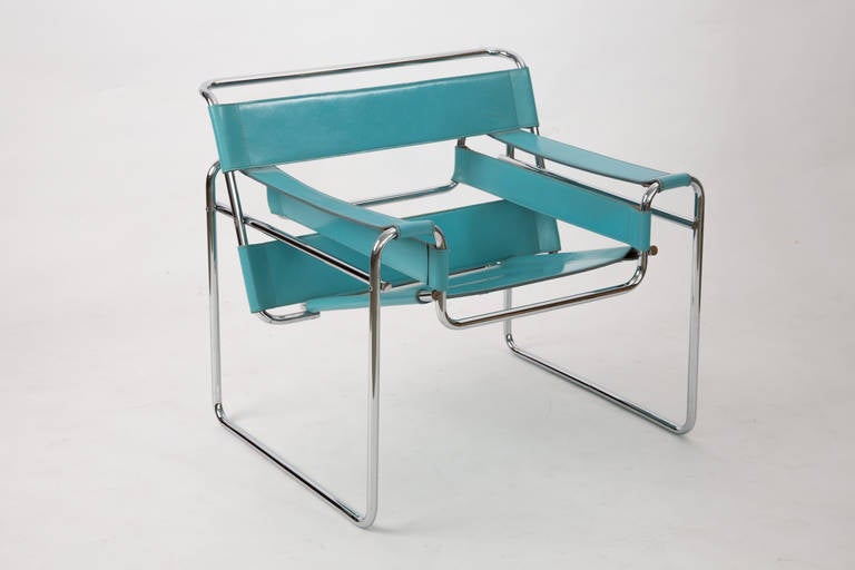 In perfect condition a Wassily chair of Marcel Breuer. In very nice blue leather. The chair has been produced 40 years ago by fasem. The chroom and the leather are in perfect condition. The ends of the tubes are massive. The colour makes you