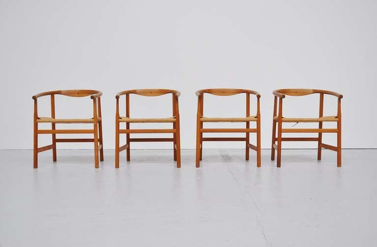 Fantastic original set of 4 dining chairs by Hans J Wegner. Typical Wegner design with many hidden finishings and rosewood inlay. All chairs marked, lovely original oak with nice patina. Original paper cord seating which has minimal wear due to