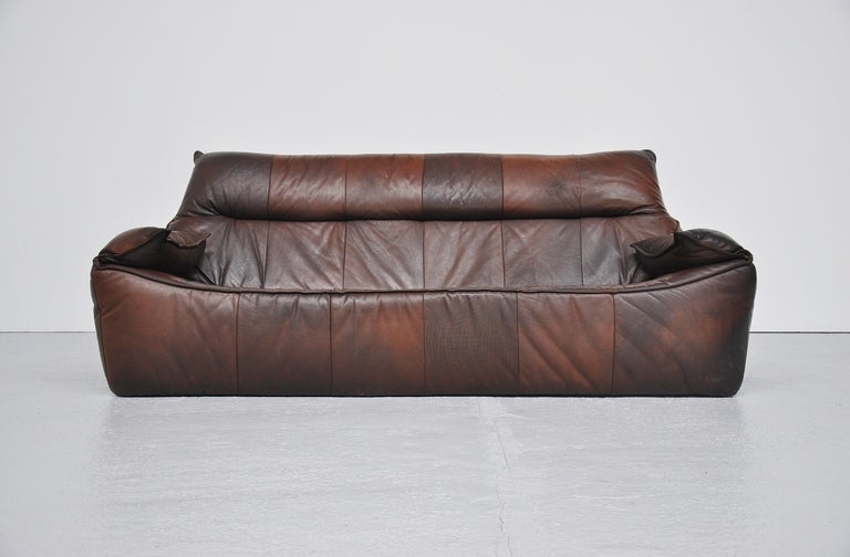 Amazing low rock / Florence sofa designed by Gerard van den Berg, Holland 1970. This fantastic patchwork leather sofa was one of the first designs by Gerard van den Berg. The sofa is in very nice condition with amazing patina from age and usage. No