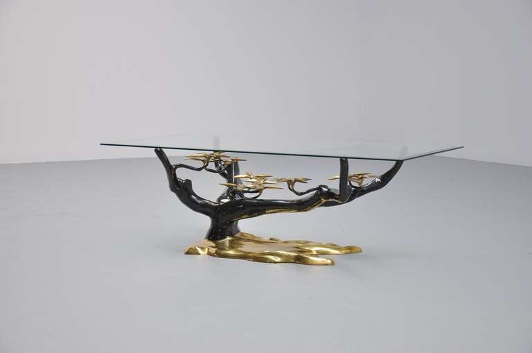 Fantastic brass and black coffee table by Willy Daro in tree form. Very nice organic shaped table with thick glass square top edged corners. Brass is in very good and clean condition, top is also in very good condition. This table would be a