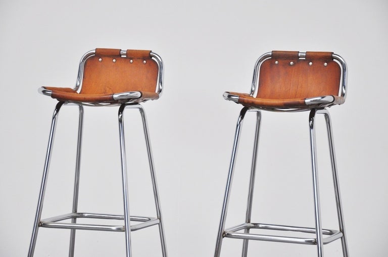 Cool and highly wanted stool by Charlotte Perriand for ski resort Les Arcs in 1960. This is for the nicest version, high stools in good original condition. The stools have chrome tubular frames and high quality thick natural leather seats. The