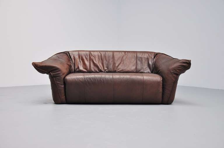 Very nice and small 2 seater sofa by Montis. Nice brown leather lovely shaped sofa with nice brown patined leather.