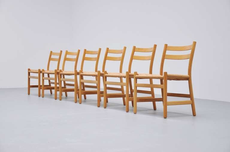 Very nice early Wegner chairs with rope seats. Very nice set of 6 with original CH stickers underneath.