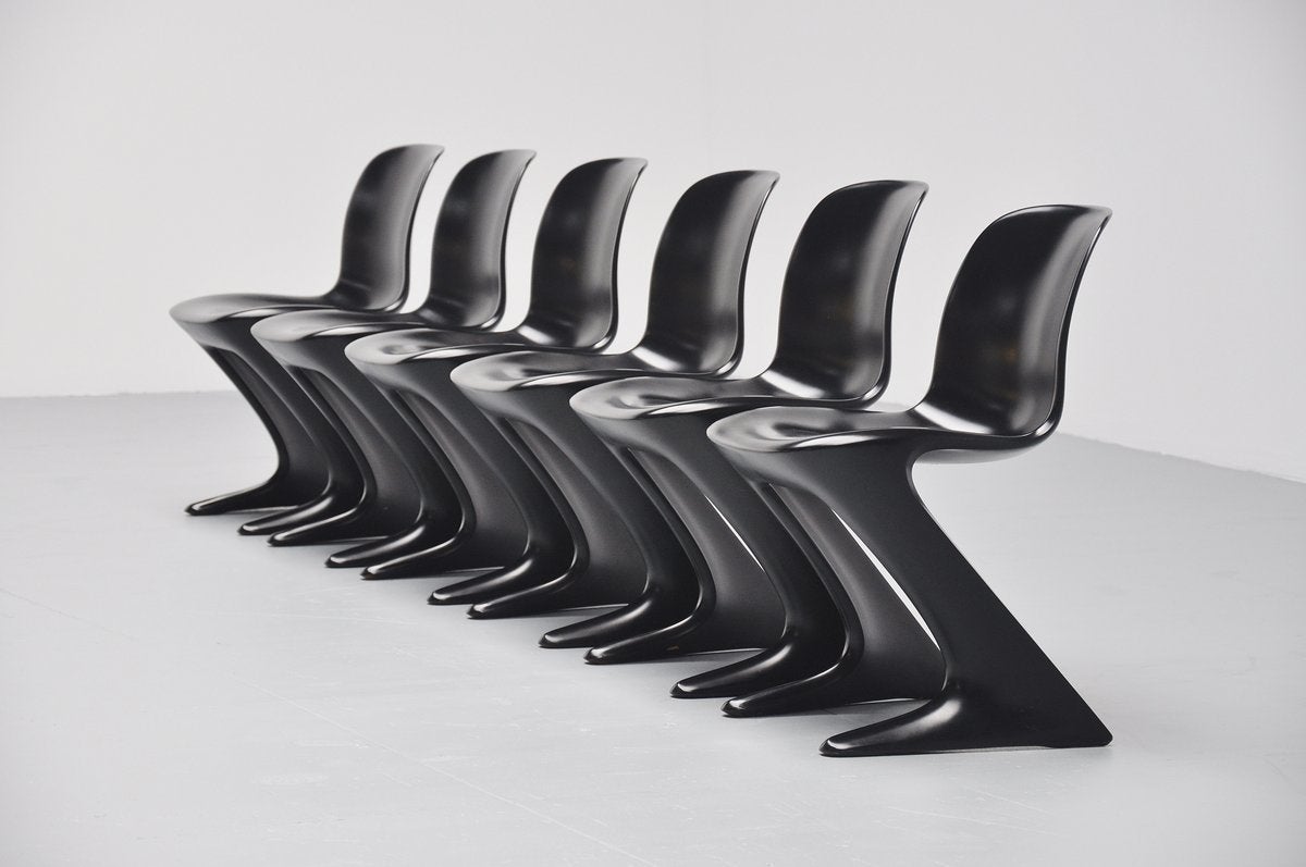 Very nice set of 6 Kangaroo chairs designed by Ernst Moeckl for Horn, Germany 1968. These chairs look great in black and you can see why they were called kangaroo chairs. Very nice black painted plastic chairs, all marked with the Horn sticker at