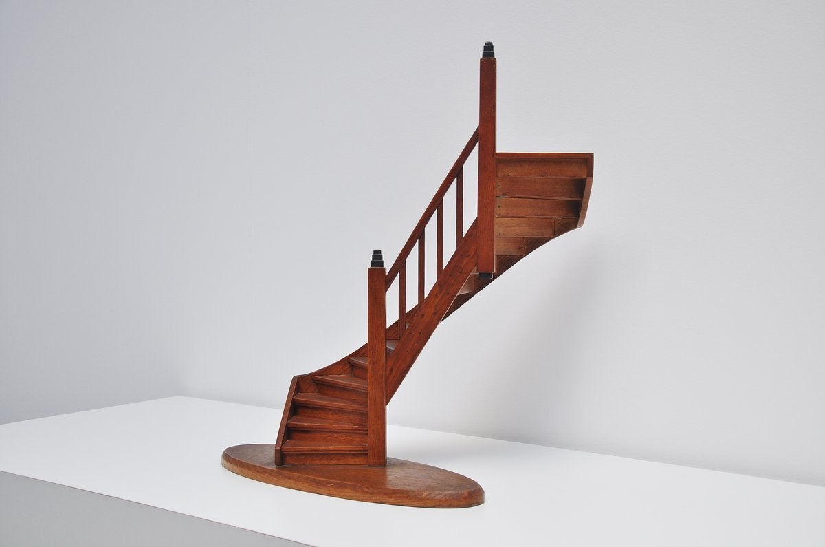 An early 20th century miniature staircase, a model for a stairs that had to be made. This one is from circa 1920, made in Holland. Very nice teak wooden stairs with black details. Fully glued and nailed. Very nice and typical Amsterdamse school