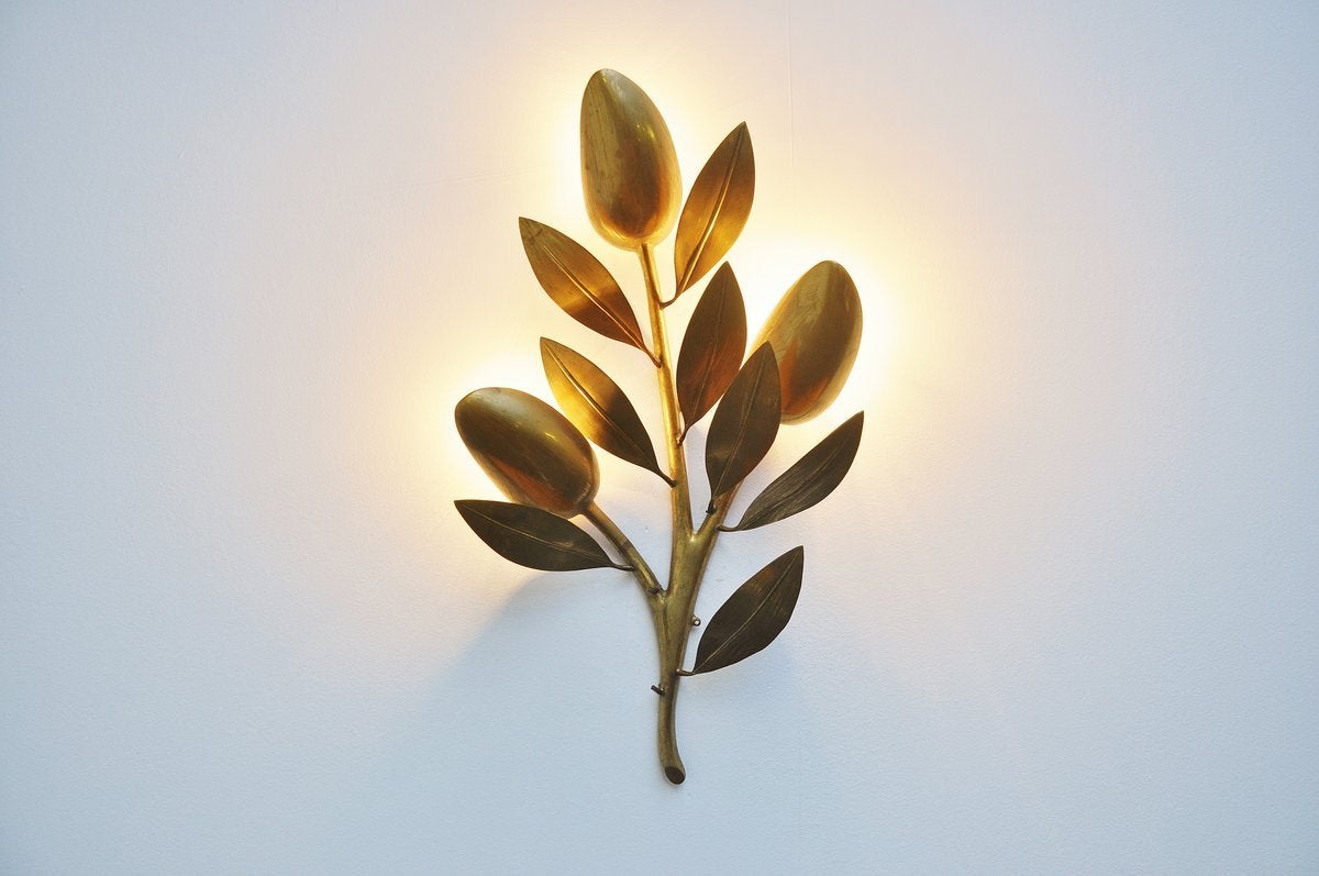 Sculptural solid bronze wall lamp attributed to Willy Daro, Belgium 1970. This lamp is made of really heavy bronze and its very well sculpted. The lamp gives very nice and warm light when lit and uses 2 lamp bulbs up to 40 watt each. Quality lamp