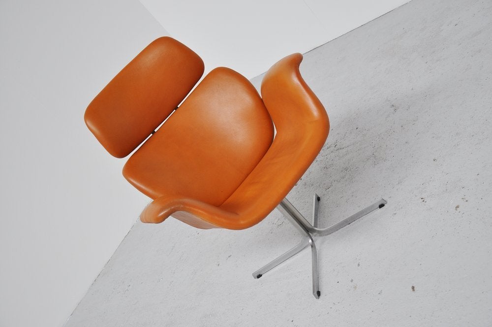 Very nice example of the Big Tulip designed by Pierre Paulin for Artifort, Maastricht 1961. This chair was called Big Tulip and was mod no 545. This chair has a very nice cognac color vynil cover and that is still the original cover. This model is