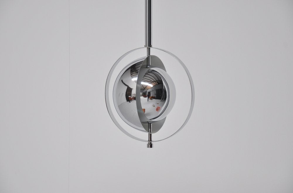 Super rare ceiling lamp made by Raak Holland. This lamp was calles Saturnus and I dont have to mention why. This was made of high quality chrome and gives fantastic light when lit.