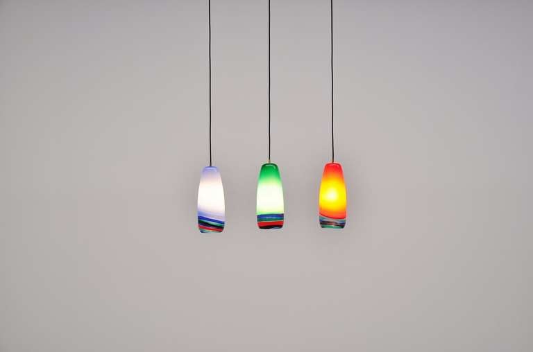 Amazing set of 3 pendant lamps by Massimo Vignelli. Rare lamps, give fantastic light when lit. A colorful addition to any home or interior.

All our lights are checked, cleaned and are suitable for use in the USA. For US usage you would only have