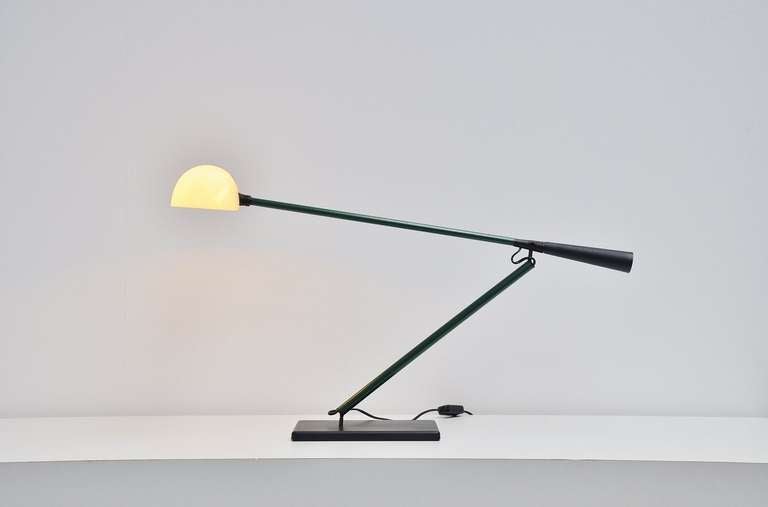Very nice and multifunctional desk or table lamp by Paolo Rizzatto for Arteluce. This is model number 613 not ton confuse with model 612 that doesnt have a base. This lamp has a weighted base and contra weight at the end of the arm, fully adjustable