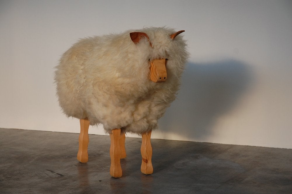ERY cool decorative life-size sheep made in the 1960s. This cool wooden sheep has real sheep skin and looks like a real one. Very nice wooden feet and face. As you can see this is quite a cool sheep and is quite large in size. Would looks very