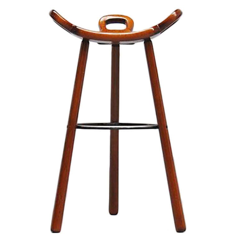 Very nice brutalist bar stools, model Marbella imported from Spain by Confonorm, 1970. Very nice stained oak wooden stools with metal feet supporting ring. Stools are very comfortable for any person and look amazing in any home or interior. We