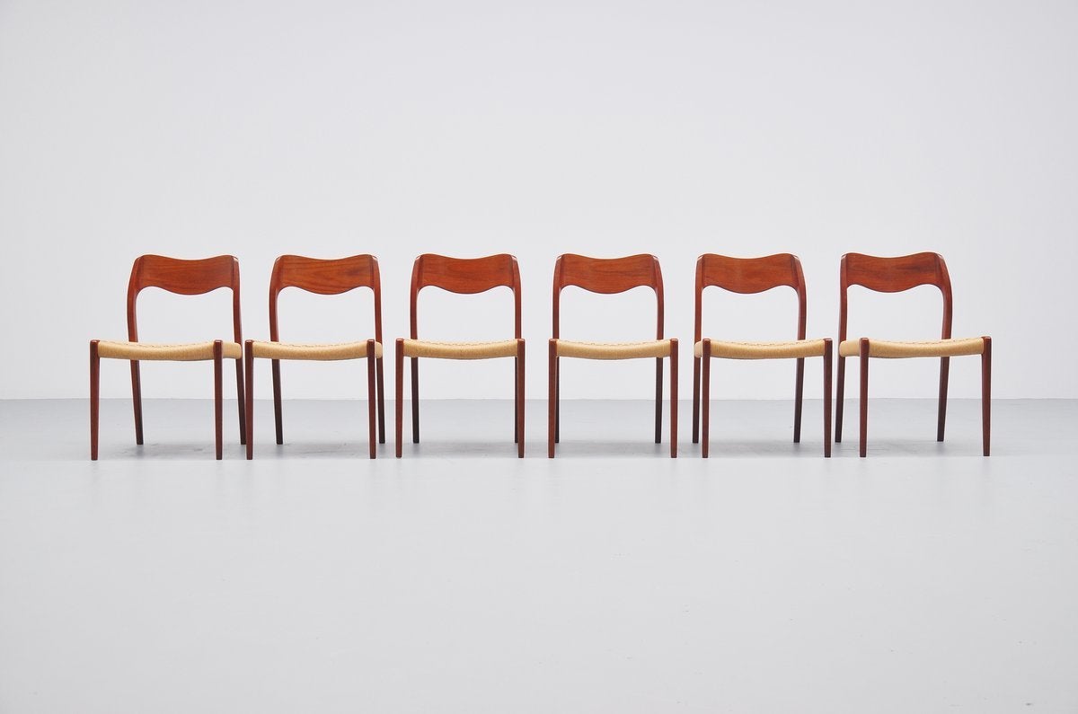 Pristine set of dining chairs designed by Niels Moller for J.L. Møller Mobelfabrik, Denmark 1951. These 6 chairs are made of solid teak and have a rope seat. They are in amazing original condition. All chairs are marked with the metal Moller tag