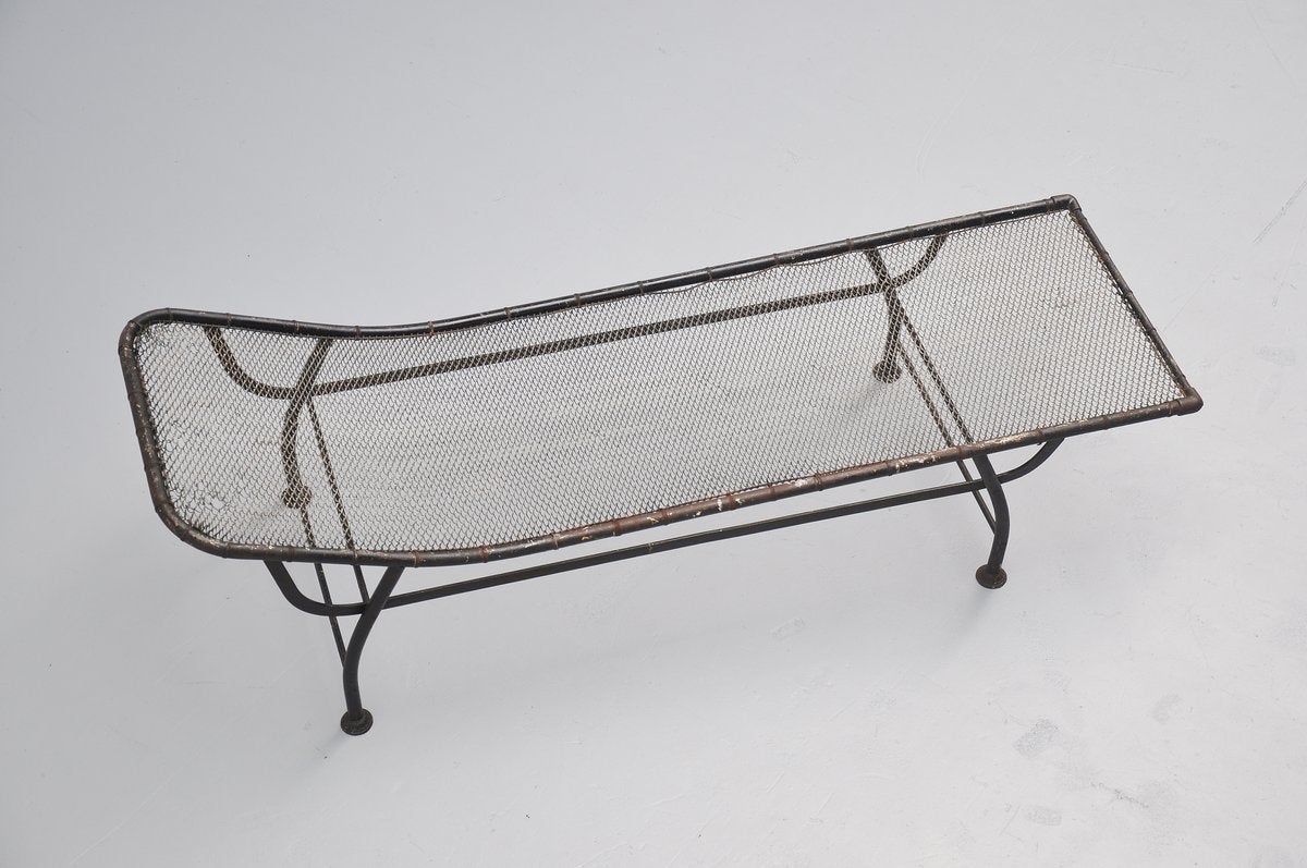 Fantastic black lacquered metal daybed with metal spiral seat. This French daybed is from ca. 1930. Highly decorative piece of French modernism design, in the manner of Jean Prouve and Pierre Jeanneret. Black painted metal with wear along the edges,