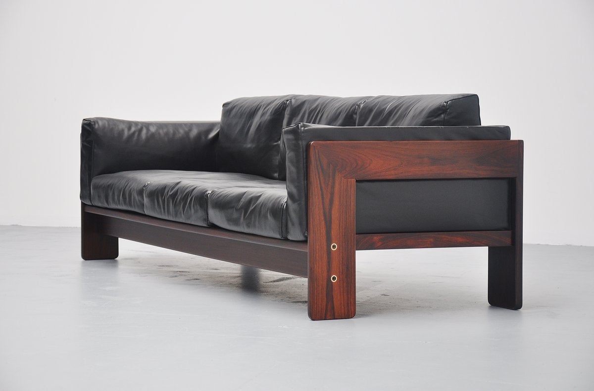 Very nice and comfortable lounge sofa from the Bastiano series, designed by Afra & Tobia Scarpa for Gavina, Italy 1968. This sofa has a solid rosewood frame and black lacquered cushions. This is for the largest version available in these series and