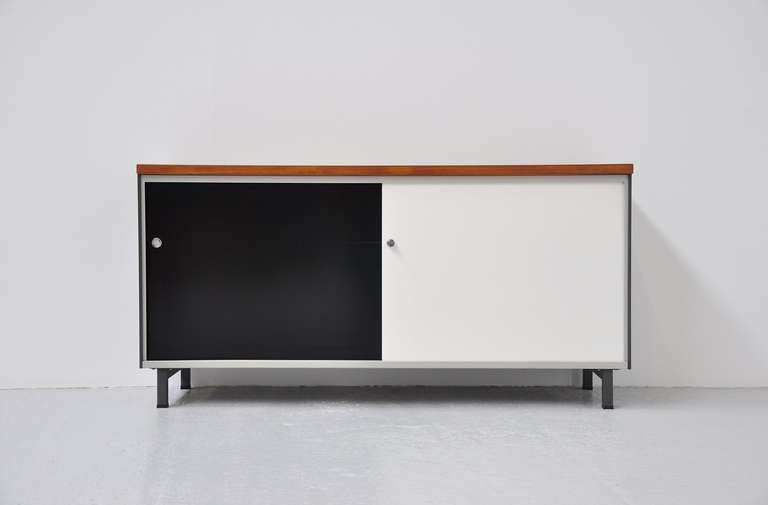 Fantastic industrial sideboard designed by A.R. Cordemeijer for Gispen, Culemborg 1962. This amazing sideboard looks a lot of some designs by Charlotte Perriand. It has a dark grey metal outside and two tone black and white sliding doors. It has a