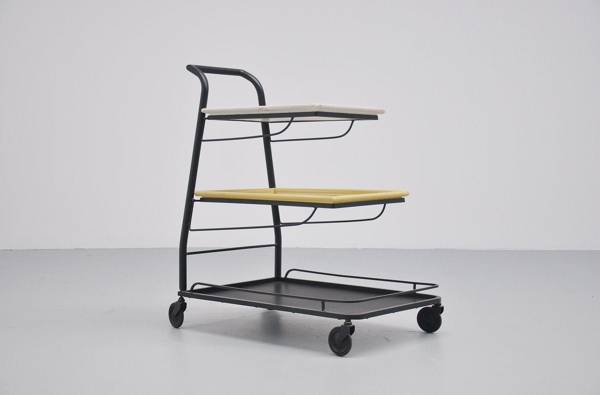 Well designed tea cart designed by Mathieu Mategot for Mategot products, France 1952. This cart comes fully a part for easy storing or shipping. Completely original black, white and yellow lacquered. Trays are die cut which was practically invented