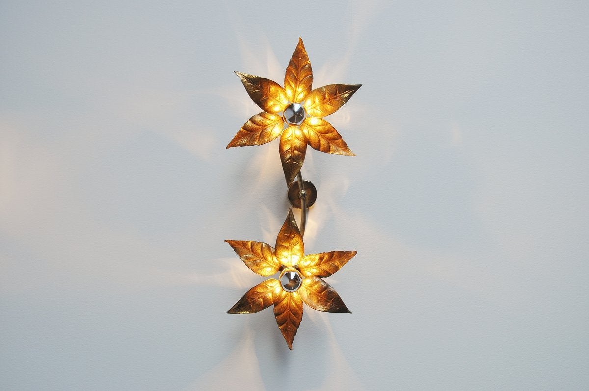 Nice pair of large wall lamps attributed to Willy Daro, Belgium 1970. These lamps are made of brass and give very nice warm light when lit. These lamps have a sculpted shape and look like a life size flower in brass. Easy to wall hang and they