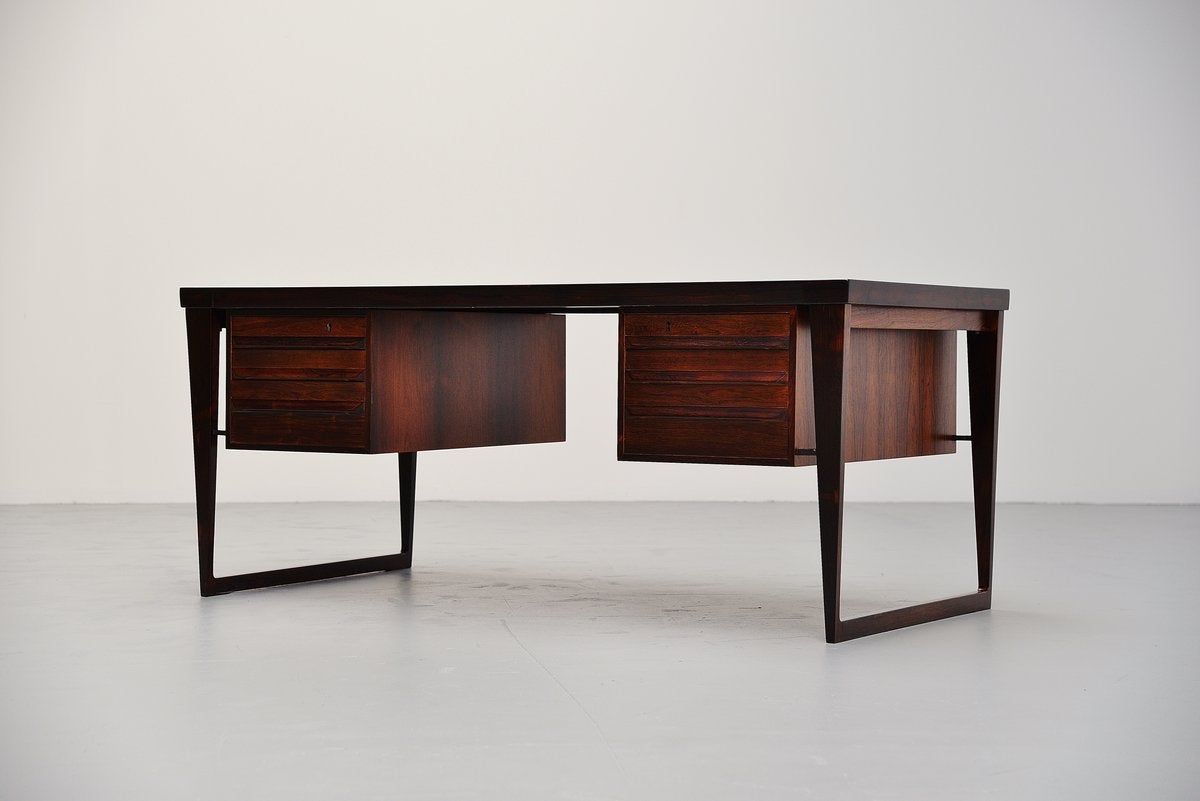 Very nice desk designed by Kai Kristiansen for Feldballes Møbelfabrik, Denmark, 1960. This amazing freestanding desk was made of rosewood with a beautiful grain. The desk has six drawers and on the back there are two more compartments for storage.
