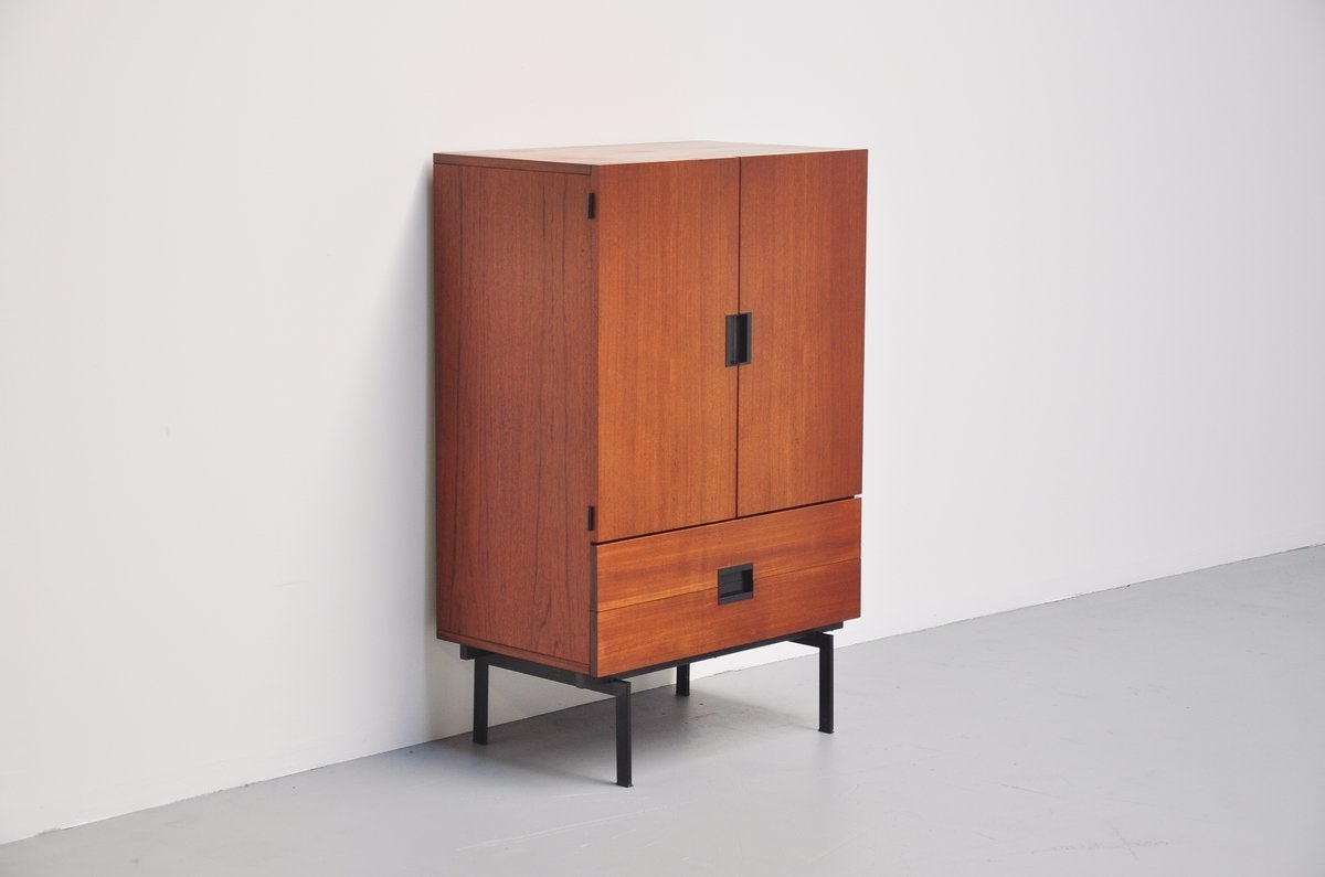 Nice small cabinet CU03 designed by Cees Braakman for Pastoe, Holland, 1958. This cabinet is from the famous Japanese series but for sure one of the nicest made. The cabinet is made of very nice and warm teak wood and has a black lacquered metal