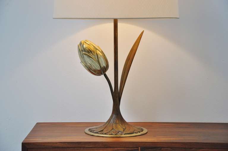 Very nice sculptural table lamp probably made by Willy Daro, Belgium, 1970. This high quality brass lamp has a very nice original fabric shade with a very nice subtle pattern on it. This lamp is completely original and in very good condition. Gives