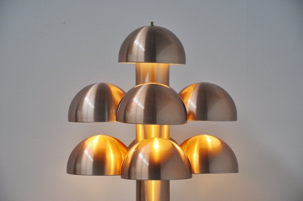 Fantastic Dutch table lamp designed by Finnish designer, Maija Liisa Komulainen for Raak. This lamp was called Cantarelle and was made or brushed aluminum. This lamp gives amazing warm light when lit.