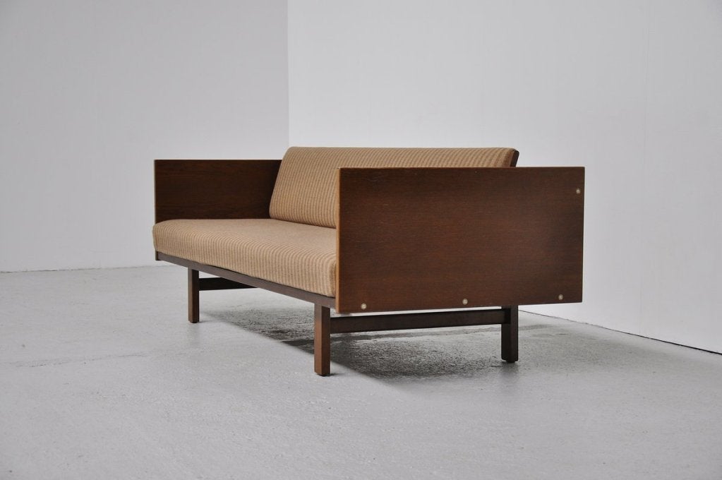 Fantastic daybed/sleeping sofa designed by Hans J Wegner for Getama, Denmark 1954. This rare daybed is completely original and in magnificent condition. The nice wool striped fabric is still original and in fantastic condition. Great contrast with