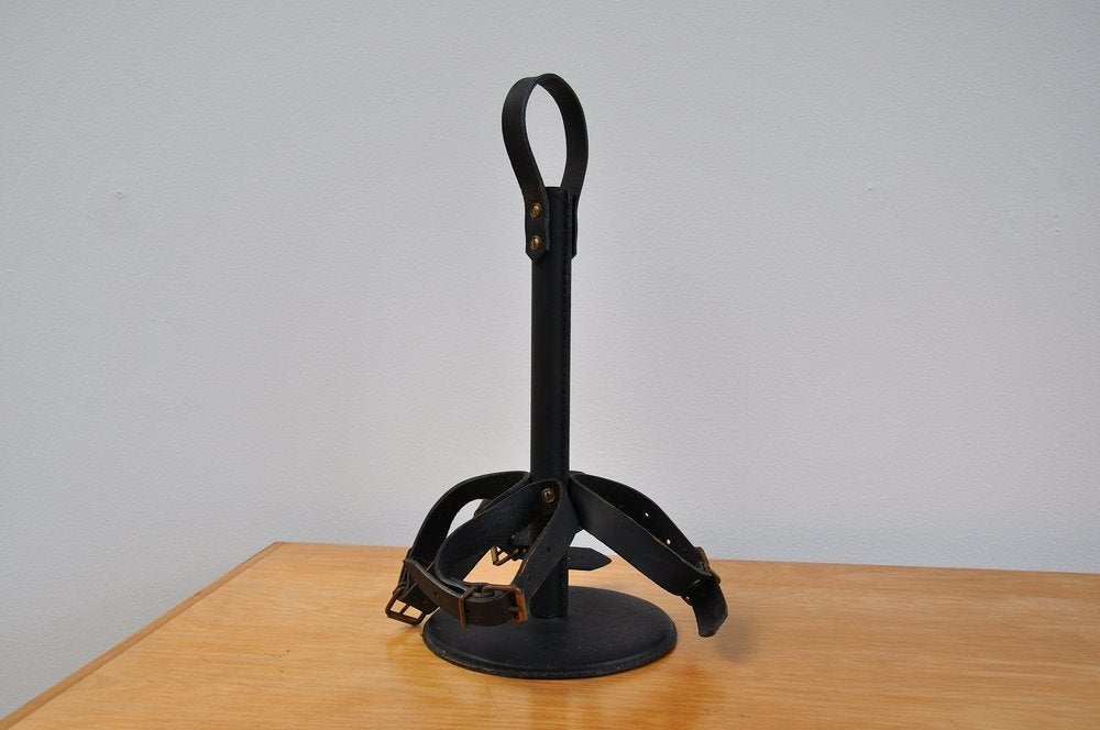 Rare Jacques Adnet bottle holder (signed a^??Modele Deposea^??), France, 1940. This very good quality bottle holder was made of black leather and is in good condition. It has a fantastic shaped and was made of high quality leather using brass