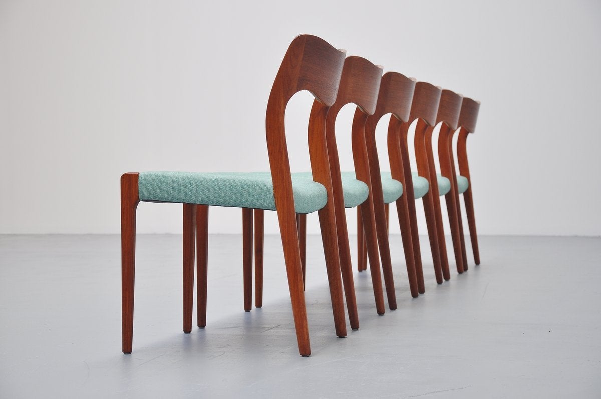 Quality dining chairs in teak, model 71 designed by Niels Møller for J. L. Møllers Møbelfabrik, Denmark, 1951. These chairs are made of solid teak and they are newly upholstered in Camira from Advantage. The nice mint green color fabric is a nice
