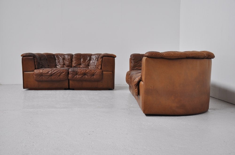 Very nice set of sofa's made by de Sede. De Sede is known by its high quality leather and super comfort seating. This is for a very cool pair of sofa's. The sofa's have very nice patined leather and look amazing from usage. This is for 5 elements