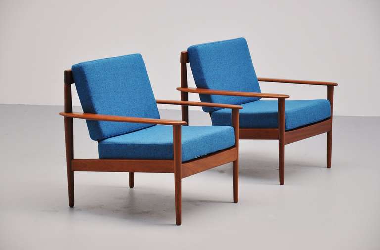 Fantastic easy chairs pair by Grete Jalok. New blue upholstery is a great
contrast with the teak wood.