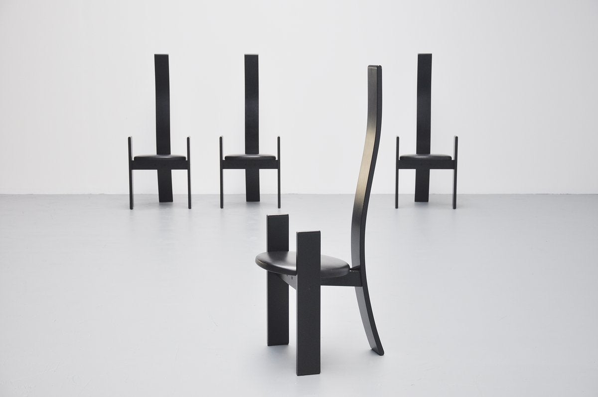 Elegant set of four dining chairs designed by Vico Magistretti for Poggi, Italy 1969. The chairs are made of black lacquered wood and have high quality leather seats. The chairs are in very good original condition. They seat very comfortable and fit