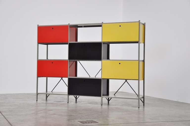 Impressive industrial bookcase wall unit room divider designed by Wim Rietveld (1924-1985) son of Gerrit Thomas Rietveld, for Gispen Culemborg in 1954. A very nice modular wall unit that can be built by your own taste and needing. This is a free