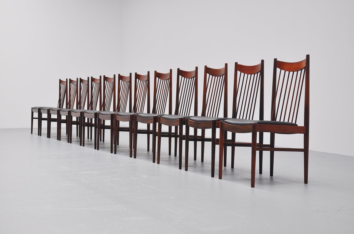 This is for a very nice and large set of dining chairs designed by Arne Vodder for Sibast Mobler, Denmark, 1960. These chairs look great in a large set of 12, hard to find a large set as these. The chairs have a solid rosewood frame and they are